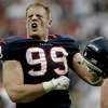 FILE - In this Jan. 7, 2012, file photo, Houston Texans defensive end J.J. Watt celebrates returning an interception for a touchdown against Cincinnati Bengals quarterback Andy Dalton during the second quarter of an NFL wild-card playoff football game in Houston.Reaching the playoffs for the last two seasons has made the Houston Texans hungry to do much more in 2013. (AP Photo/Tony Gutierrez, File)