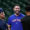 New York Mets pitcher Justin Verlander, center, talks with Houston Astros' Alex Bregman, left, and Michael Brantley, right, before a baseball game Monday, June 19, 2023, in Houston. (AP Photo/David J. Phillip)