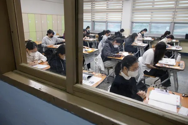 Students waiting for the start of the annual college entrance examination in Seoul last year. The test is known for its rigor and has been openly criticized by academics.