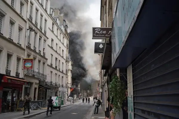 Smoke billows from a building following an explosion in Paris on Wednesday.